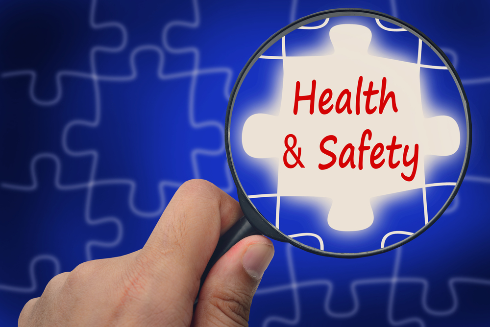 Photo of Health and safety word, Magnifier and puzzles.