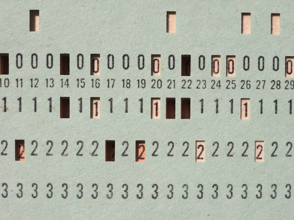 Photo vintage punched card for computer data storage and programming