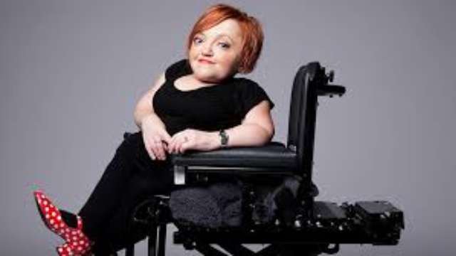 Stella Young sits in a wheelchair.