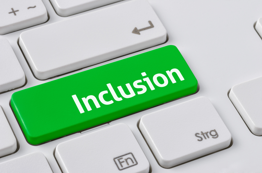 The word, Inclusion, is on the enter key of a keyboard.