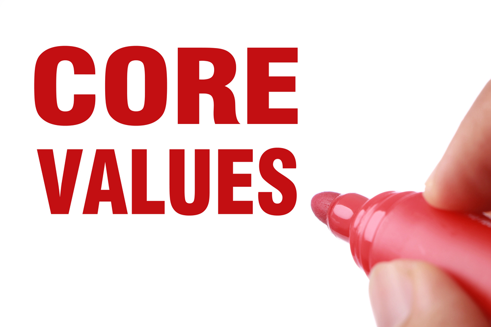 The words, Core Values, are written on a whiteboard in red.