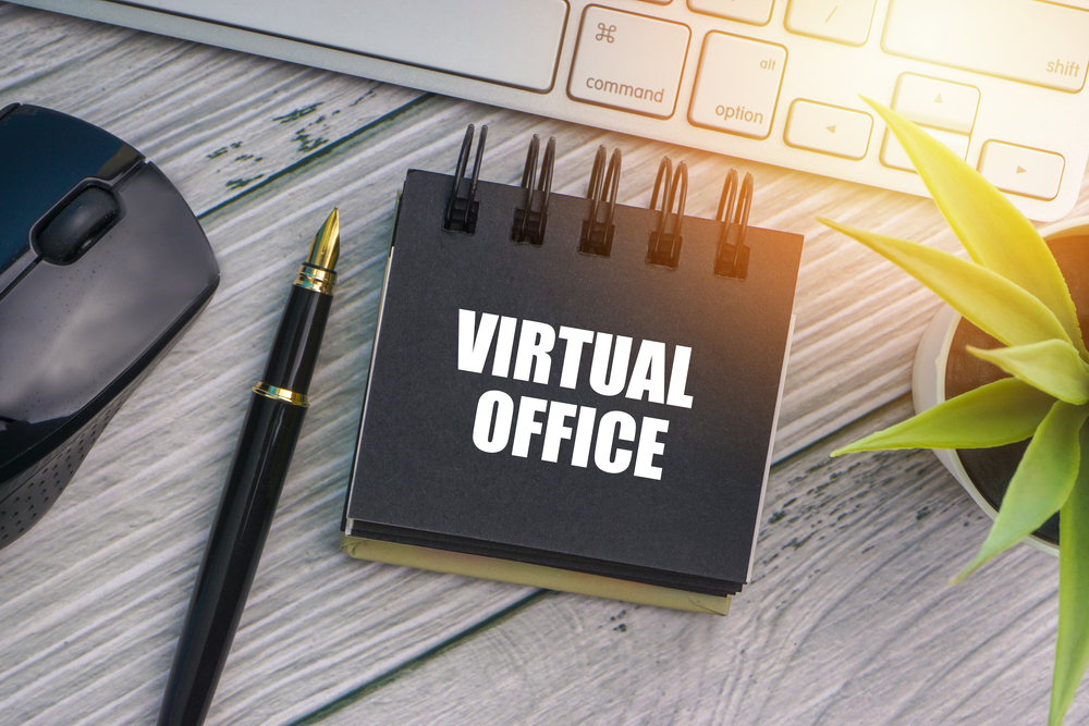 Visual Office Image showing a mouse, pen, notepad with the words "Virtual Office" and a plant to the left of the notebook