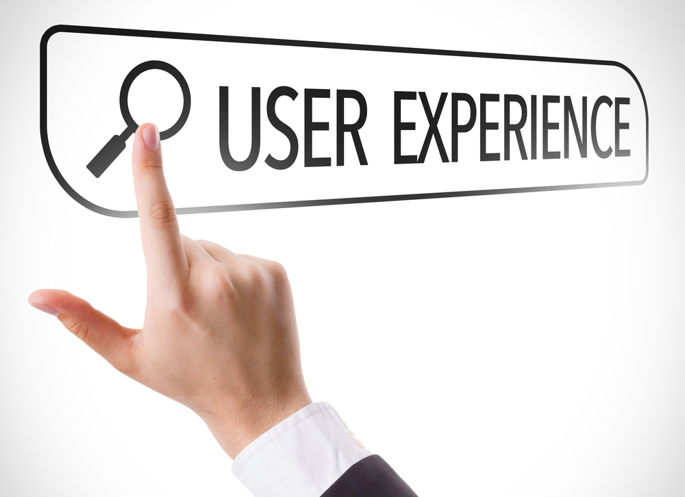 Image of hand pointing to the words, User Experience