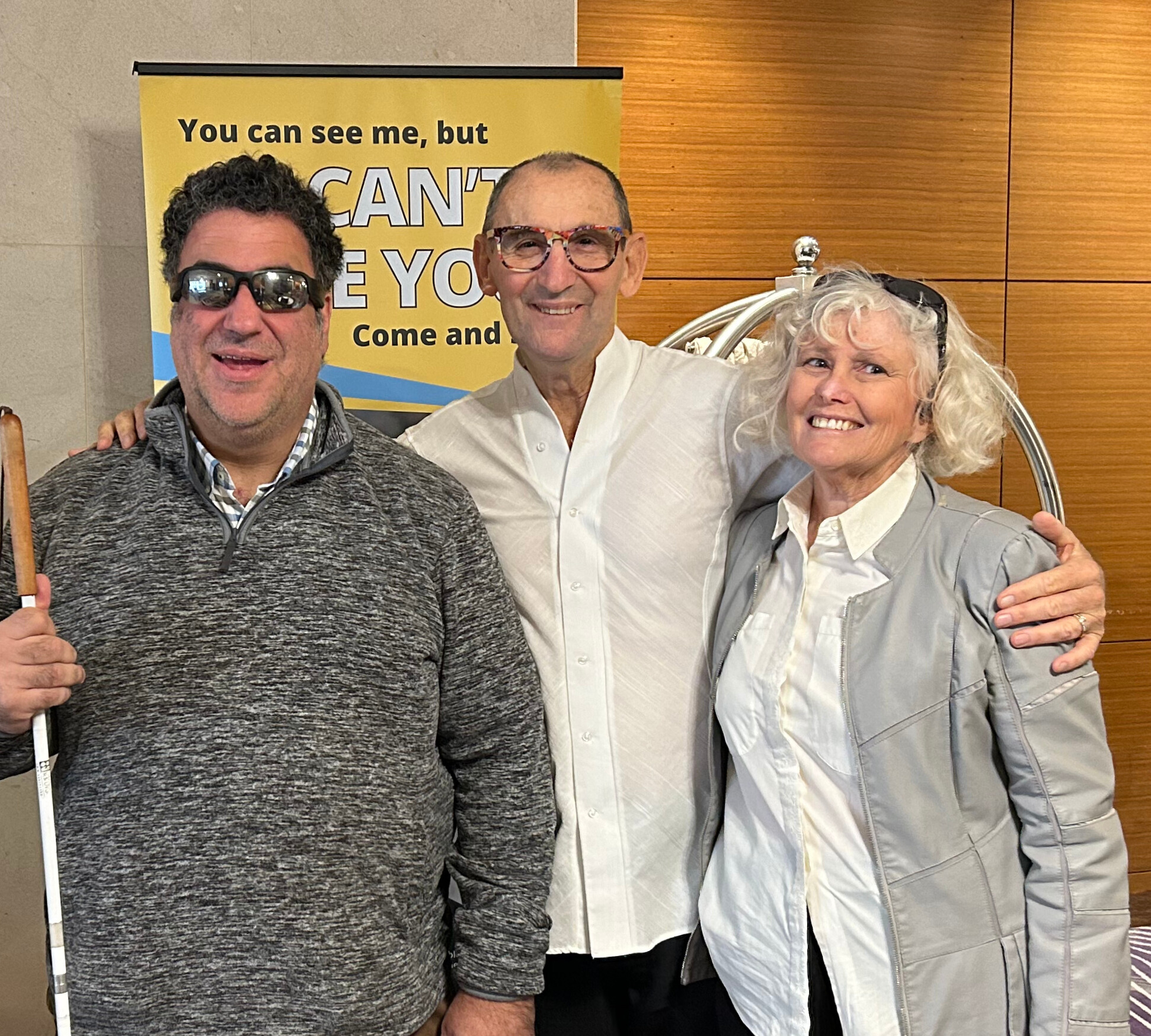 Mark Muscat, Allan Parker and Narelle Wright Gatti are smiling at the camera.