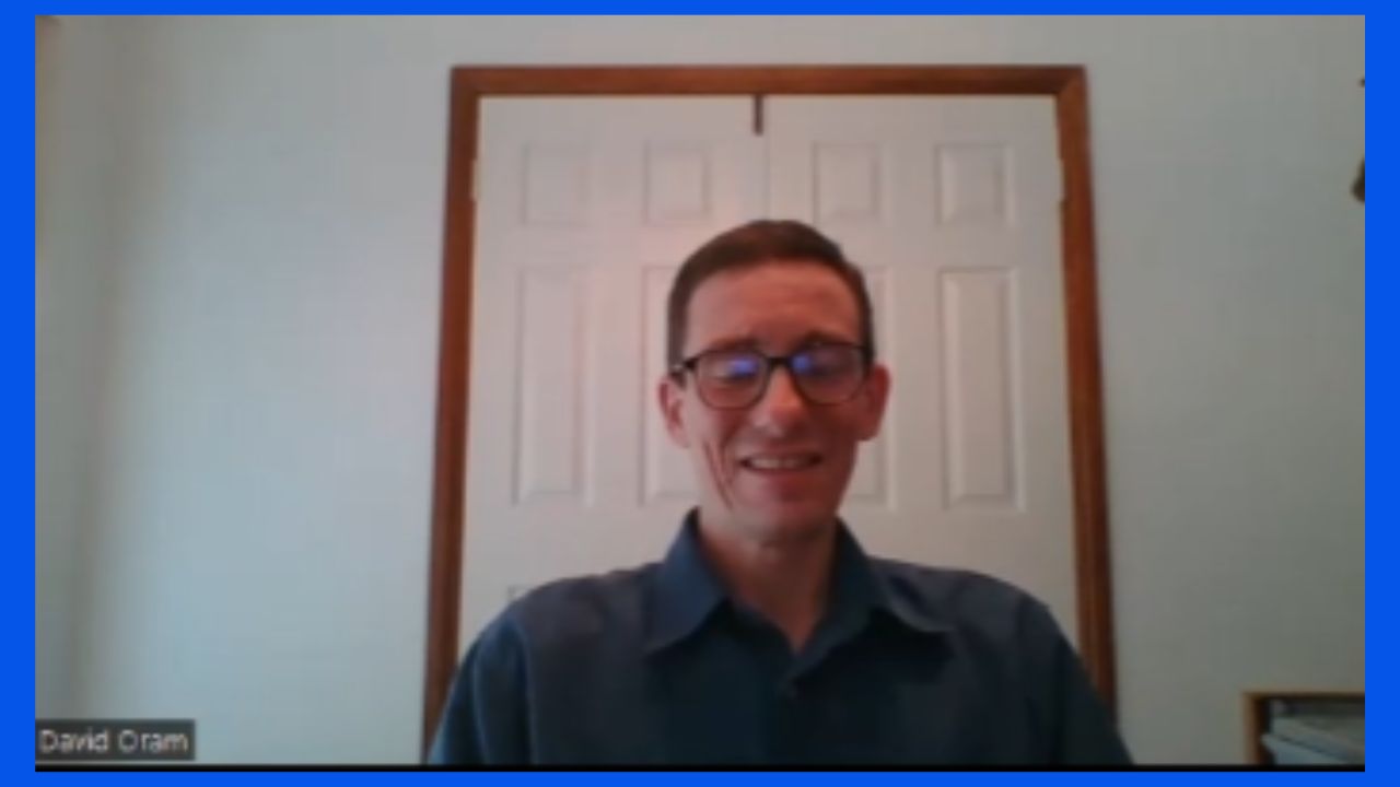 David Oram is sitting in an office