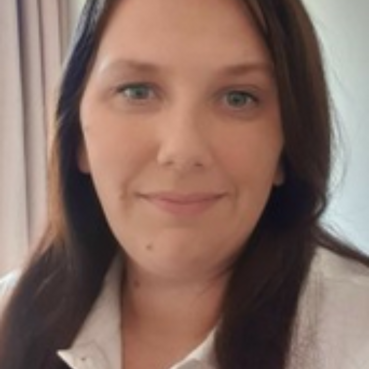 Jodi Kneepkens from Going Daily Assisted Transport has long brown hair.