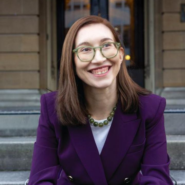 Tiffany Ashdown is wearing a purple jacket.